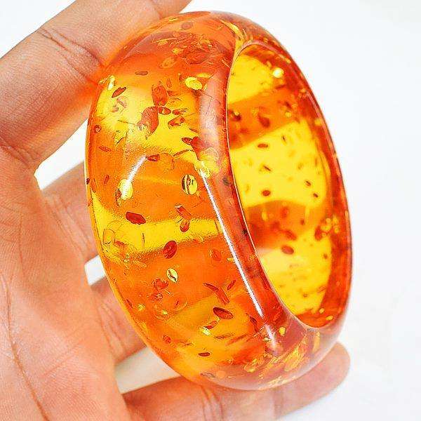 gemsmore:Exclusive Synthetic Amber Carved Bangle - Jewellery