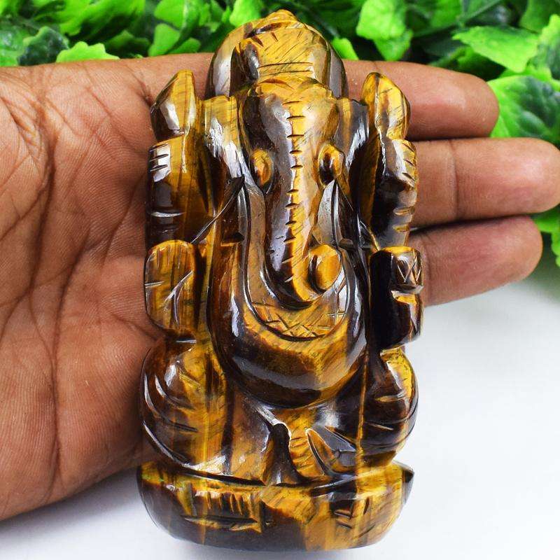 gemsmore:Golden Tiger Eye Hand Carved Lord Ganesha Idol