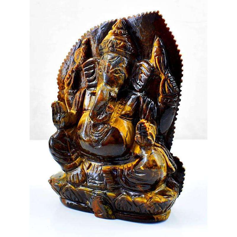 gemsmore:Hand Carved Golden Tiger Eye Ganesha With Leaf At Back