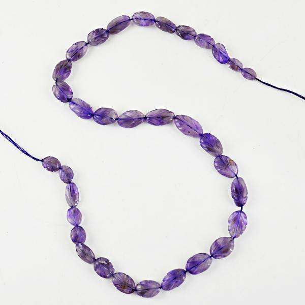 gemsmore:Natural Purple Amethyst Carved Oval Shape Drilled Beads Strand
