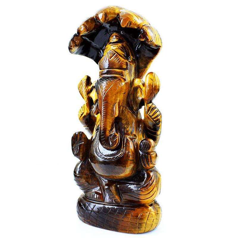 gemsmore:Premium Golden Tiger Eye Lord Ganesha Carved Idol With Snake At Back