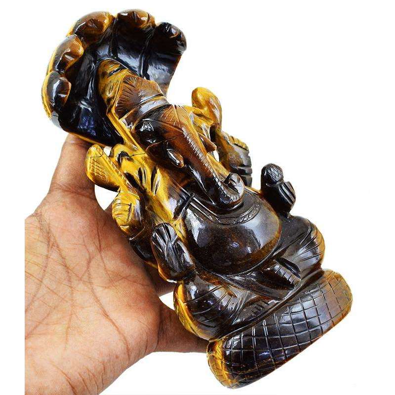 gemsmore:Premium Golden Tiger Eye Lord Ganesha Carved Idol With Snake At Back