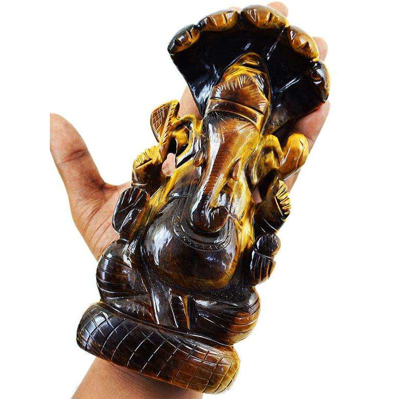 gemsmore:Premium Golden Tiger Eye Lord Ganesha Carved Idol With Snake At Back