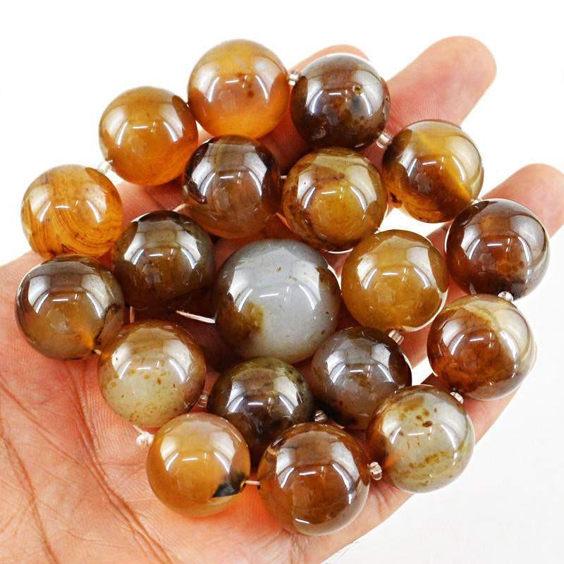 gemsmore:Round Shape Brown Onyx Strand Natural Untreated Drilled Beads