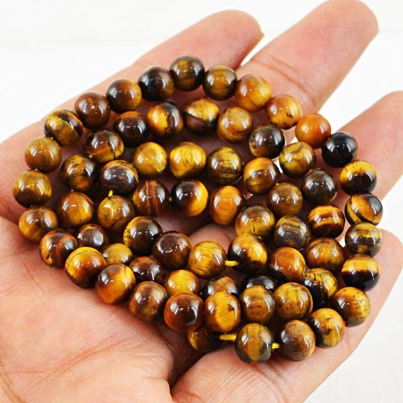 gemsmore:Untreated Golden Tiger Eye Strand Natural Round Shape Beads